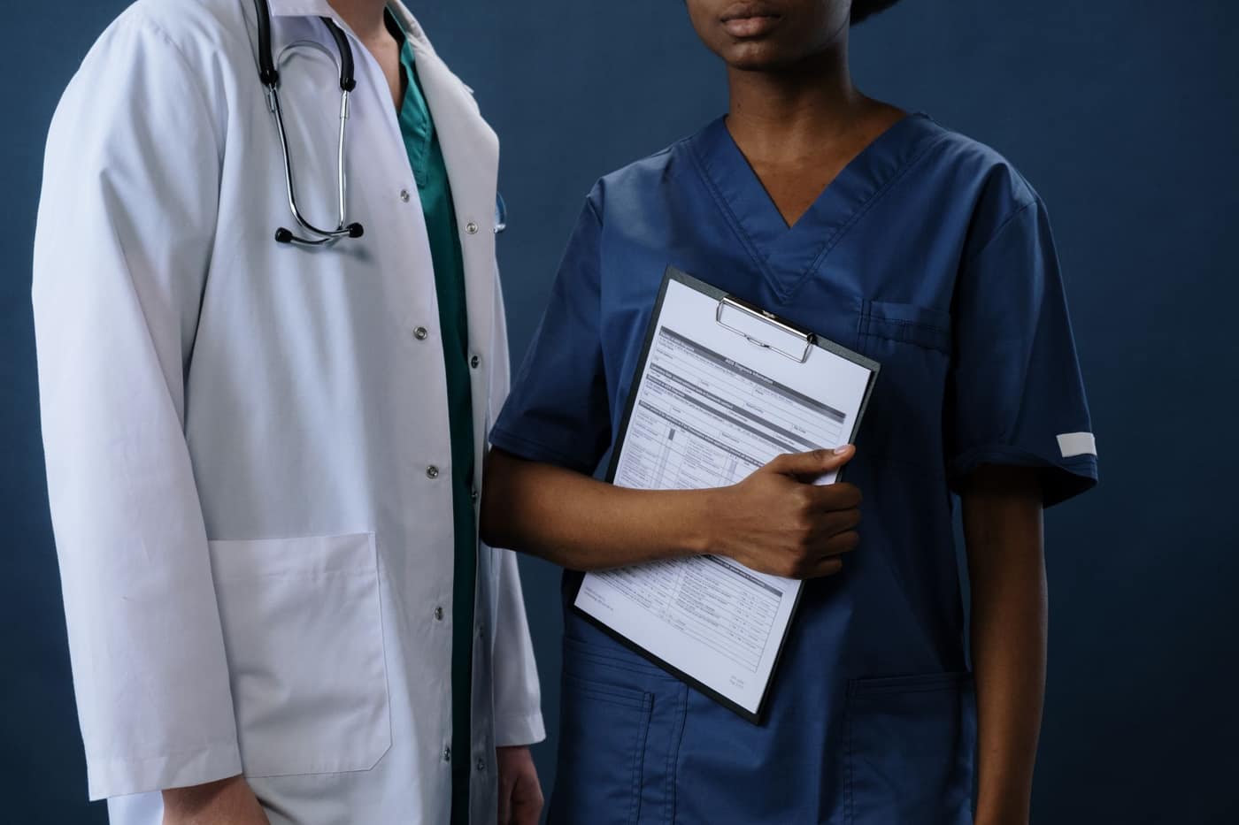 Doctor reviewing practice metrics on a screen
